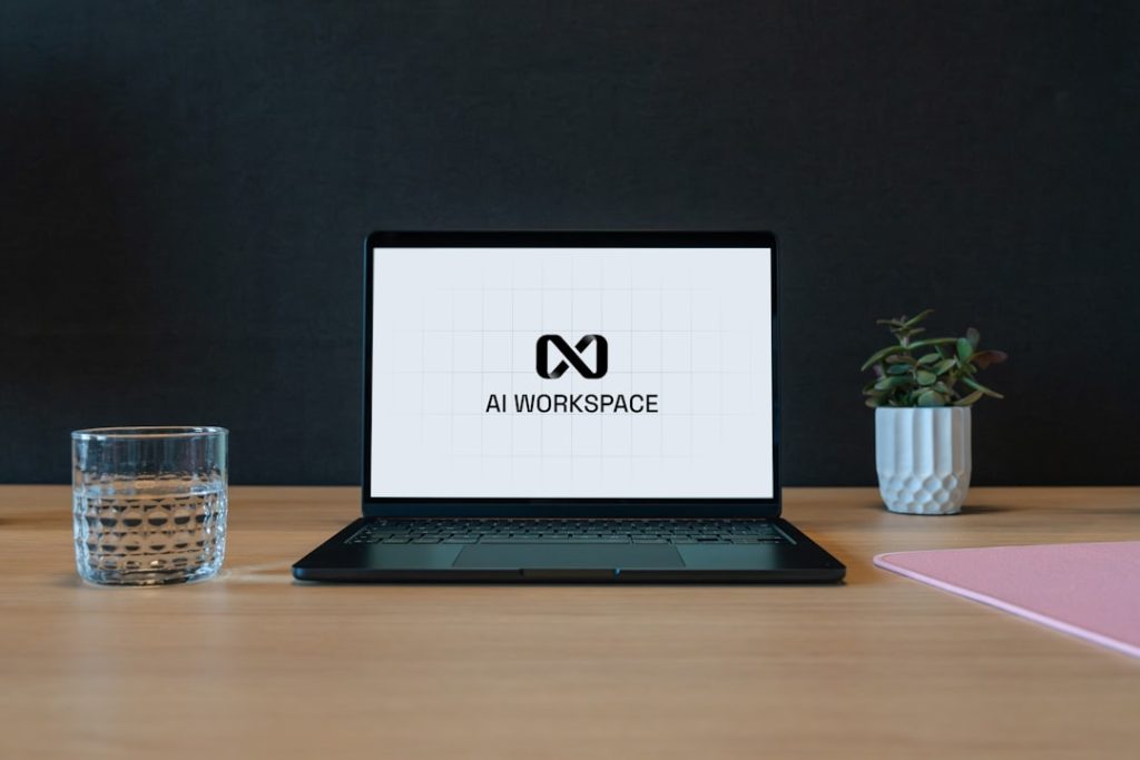 A laptop open on a desk displaying an AI workspace interface, illustrating the AI tools a coach uses to run a practice.