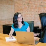 A coach and client in a one-on-one session, the kind of work life coach software is built to support